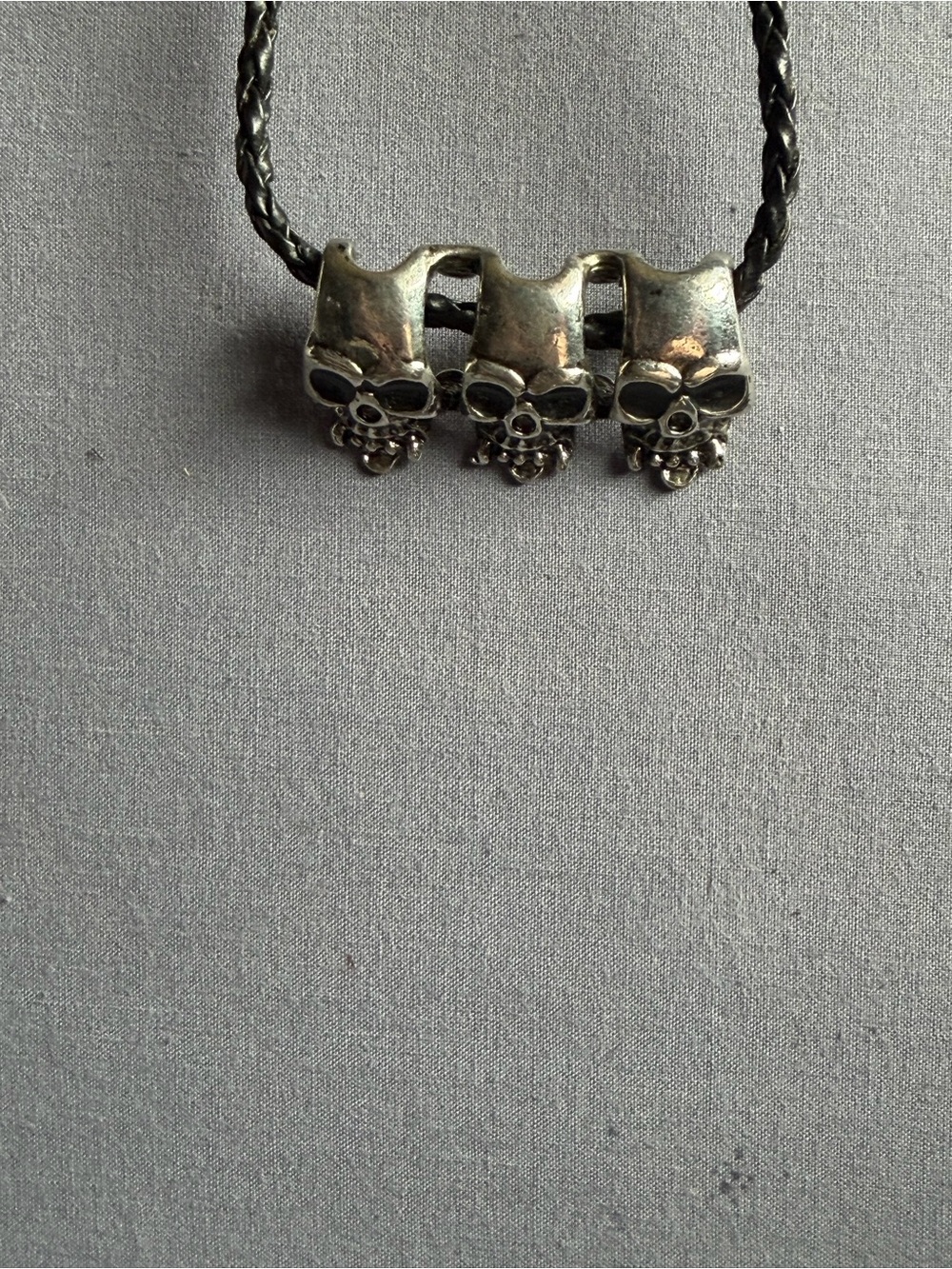 Triple Skull Pendant Necklace in Silver-Tone on Black Cord